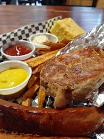 Pork Loin Chops Sausage House Cut Fries and Cornbread